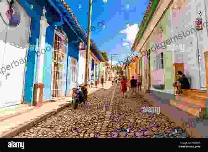 A Colorful Street Scene In Trinidad, Cuba, With Pastel Painted Buildings And Cobblestone Roads. Cuba In Pictures: Cienfuegos Trinidad Guanayara