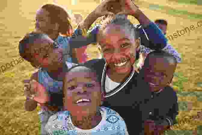 A Group Of Smiling African Children Playing In A Village INTO AFRICA : A Personal Journey